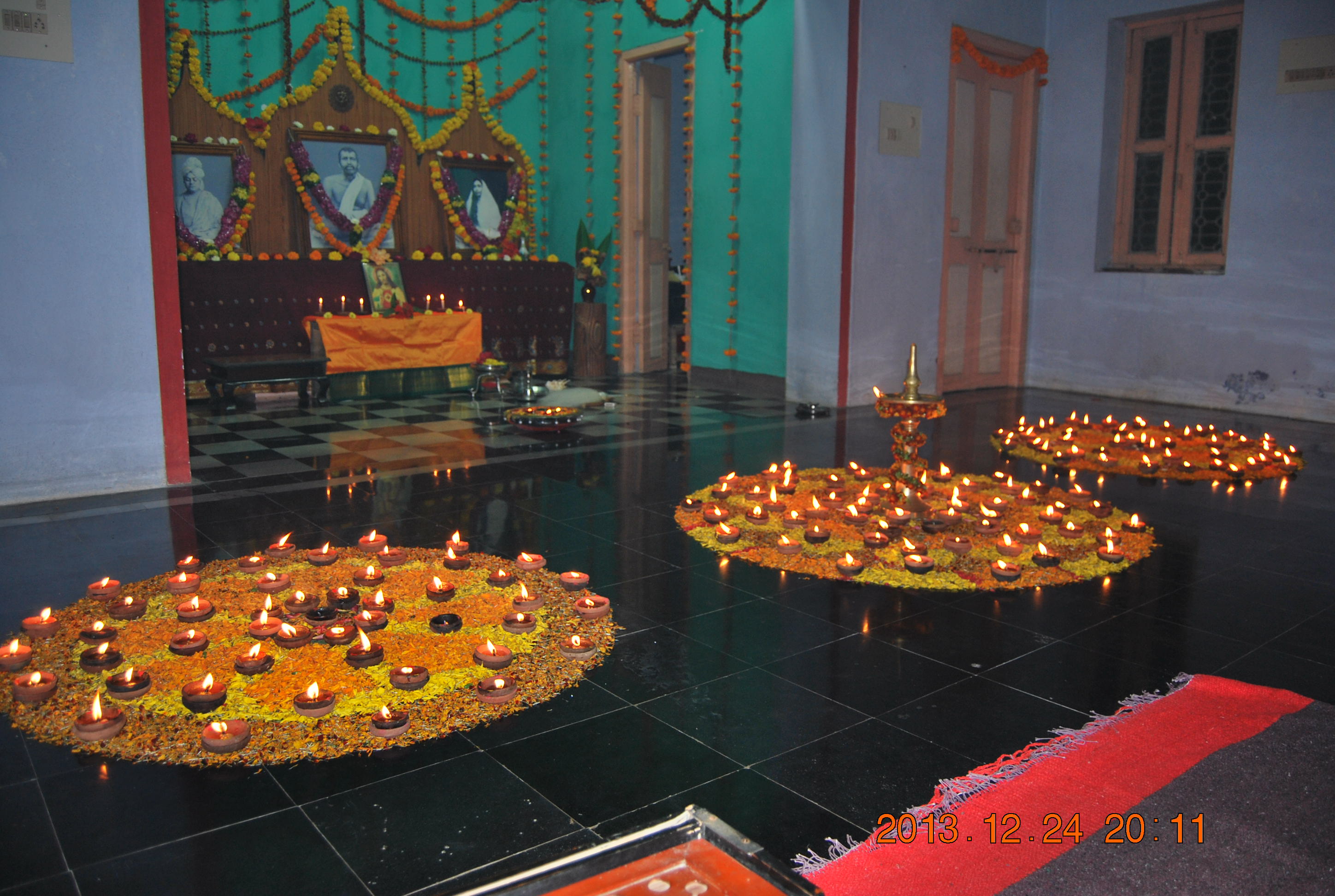 Evening: lighting lamps by devotees